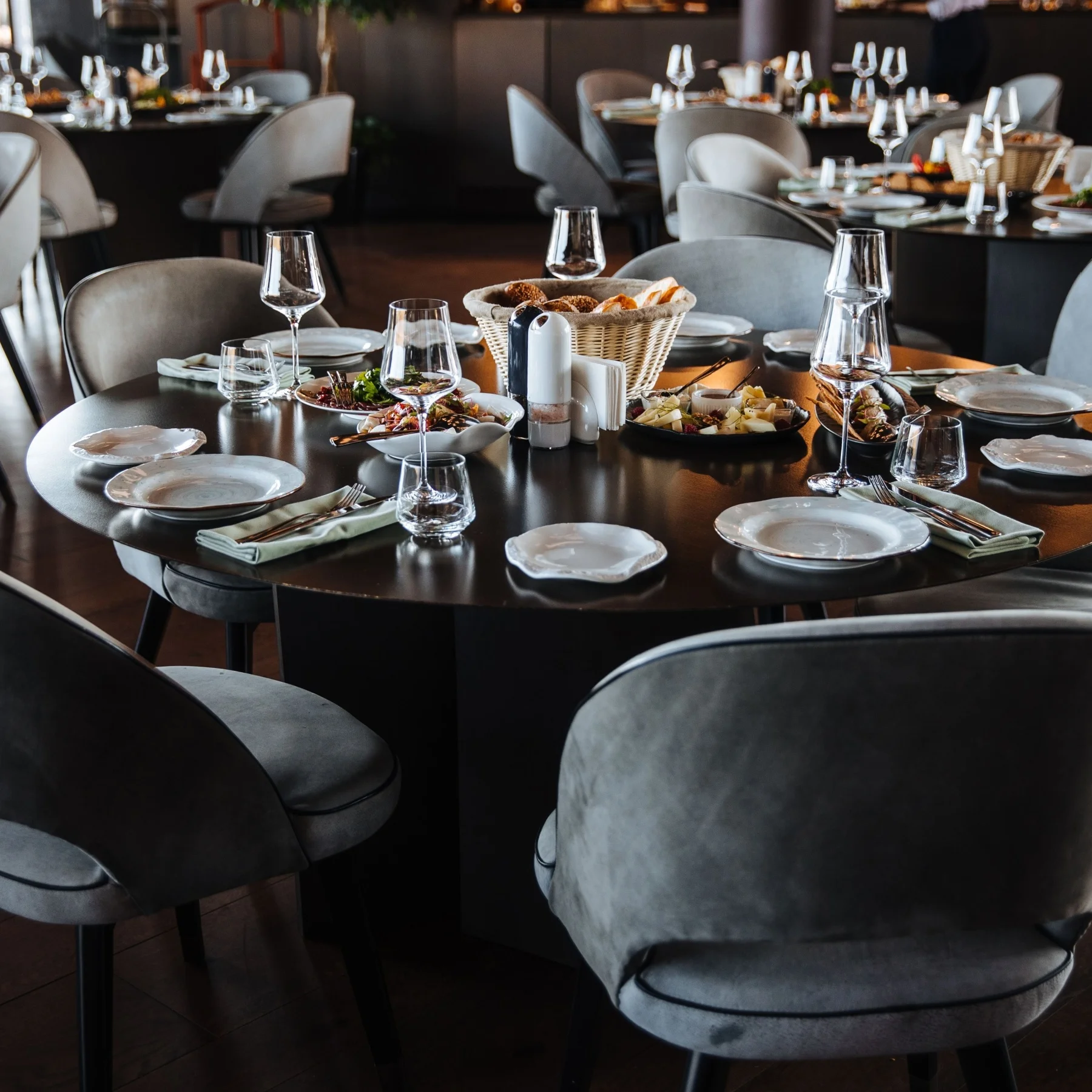 fine dining restaurant with fancy seats and plates and cutlery